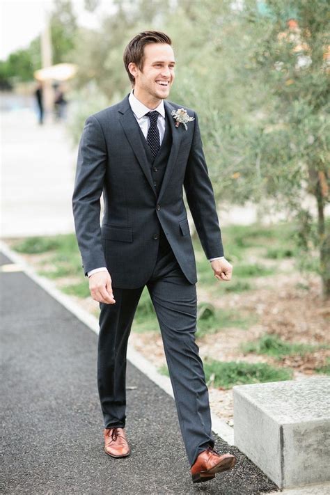 brown shoes with charcoal suit.